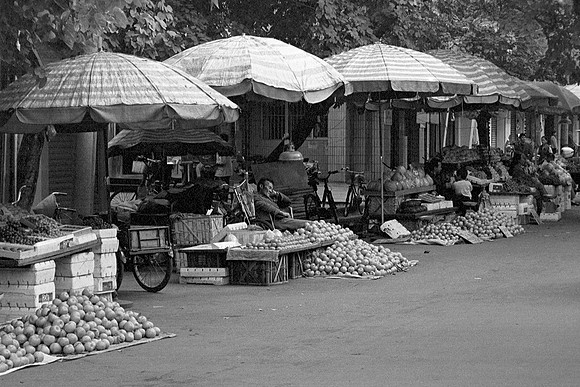 Sleepy Fruit Vendor, Nanning, China 1999