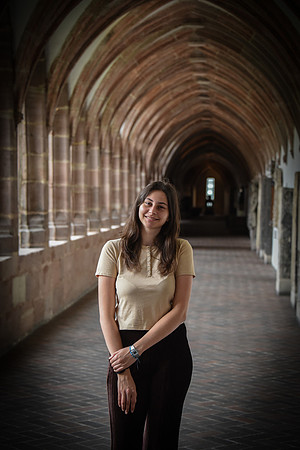 Monia in Arched Hallway