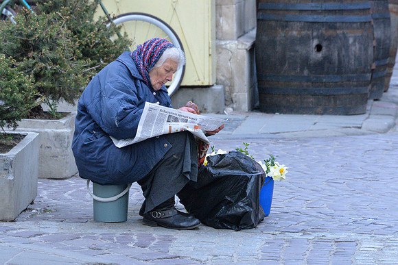 Old Woman Reading Newspaper